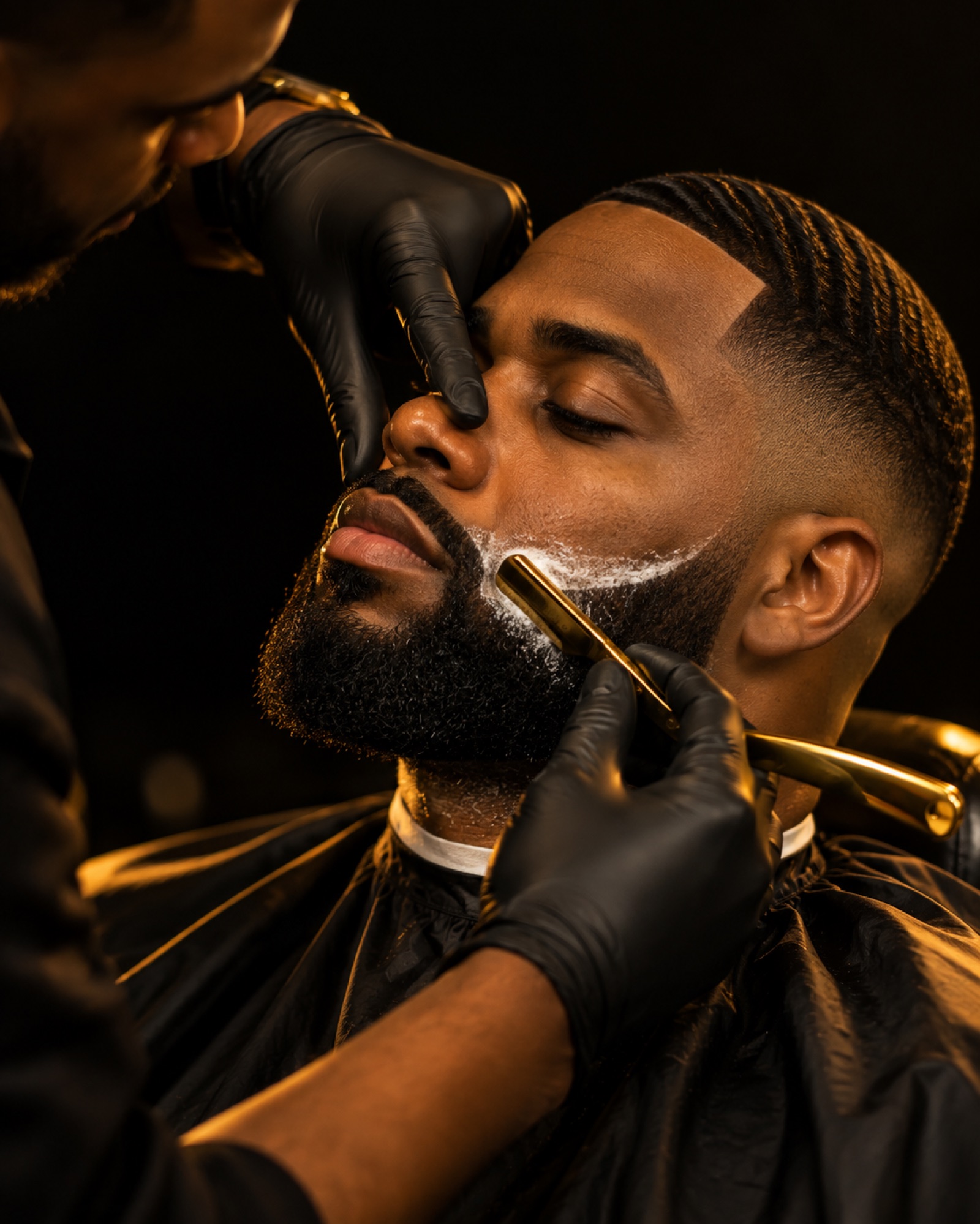 Beard lineup with a gold straight razor on a low skin fade