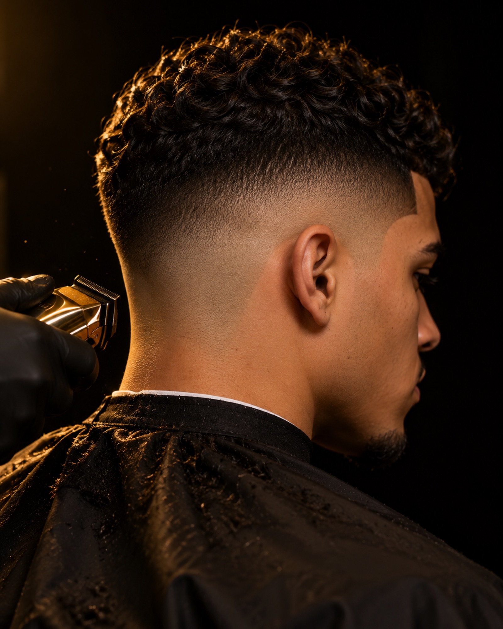 Mid drop fade with curly top, back view